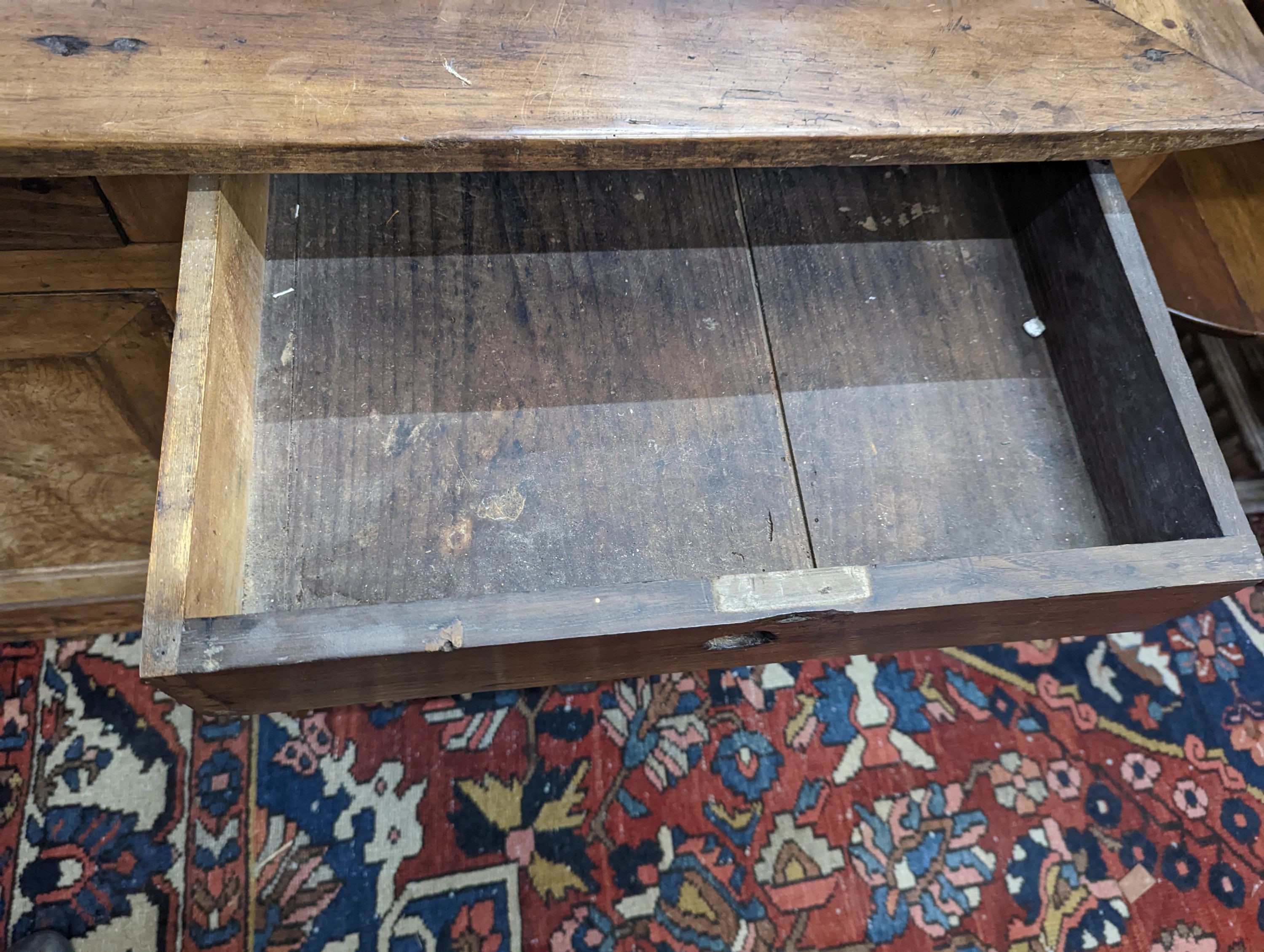 A late 18th / early 19th century French walnut and fruitwood side cabinet, width 130cm, depth 65cm, height 92cm